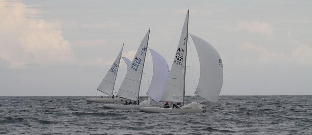 Etchells Nationals Championship 2013, lined up on the run on day three. Peter McNeill’s Iris III (1325), Matthew Chews’ Gen XY (864) and John Bertrand’s Triad (1383). © Michael Jennings